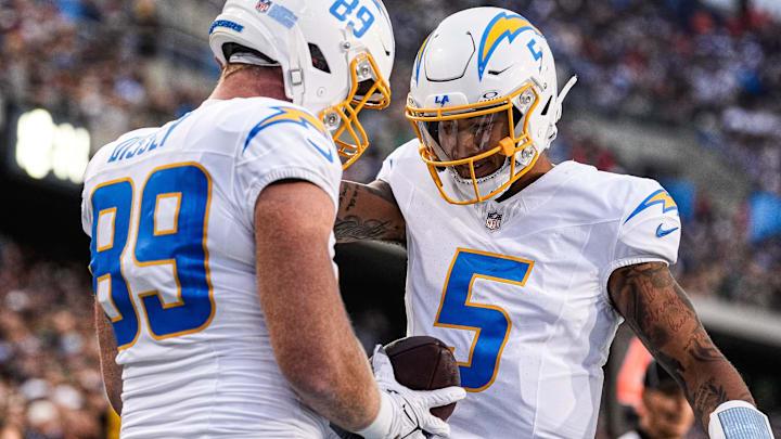 LA Chargers tight end Will Dissly (89) celebrates a touchdown against Detroit Lions with quarterback Trey Lance (5) during the first half of the Hall of Fame Game at Tom Benson Hall of Fame Stadium in Canton, Ohio on Thursday, July 31, 2025.