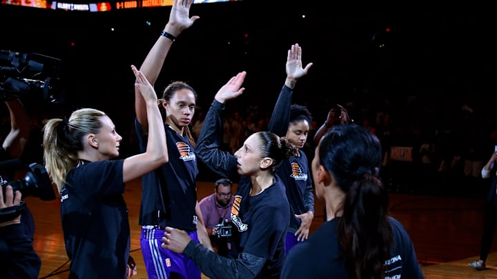 Sep 7, 2014; Phoenix, AZ, USA; Phoenix Mercury guard Diana Taurasi (right) high fives center Brittney Griner (center) and forward Penny Taylor prior to the game against the Chicago Sky during game one of the WNBA Finals at US Airways Center. The Mercury defeated the Sky 83-62. Mandatory Credit: Mark J. Rebilas-Imagn Images

