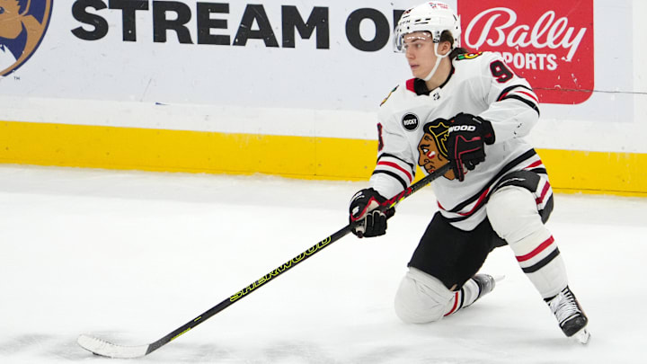 Nov 12, 2023; Sunrise, Florida, USA; Chicago Blackhawks center Connor Bedard (98) plays the puck against the Florida Panthers during the second period at Amerant Bank Arena. Mandatory Credit: Jasen Vinlove-Imagn Images