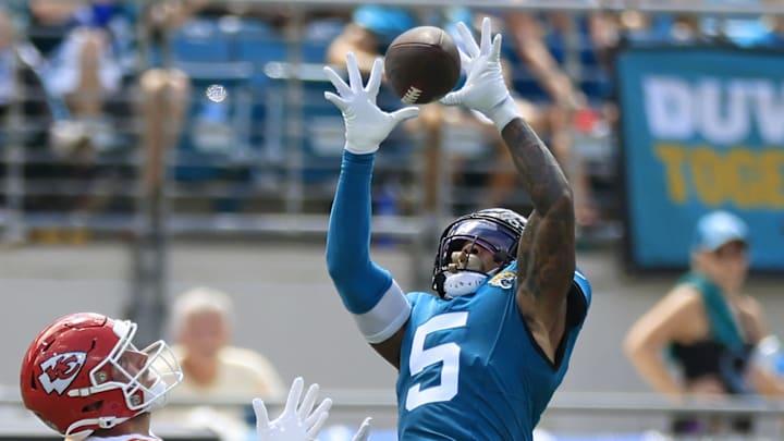 Jacksonville Jaguars safety Andre Cisco (5) picks off a pass intended for Kansas City Chiefs wide receiver Justin Watson (84) during the second quarter of a NFL football game Sunday, Sept. 17, 2023 at EverBank Stadium in Jacksonville, Fla. [Corey Perrine/Florida Times-Union]