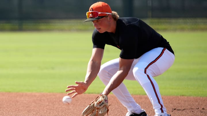 Orioles infielder Jackson Holliday scoops up a ground ball during drills on Tuesday. The Baltimore Orioles held their first full-squad workout of the 2025 spring training season on Tuesday, Feb. 18th in Sarasota, Florida. Orioles infielder Jackson Holliday scoops up a ground ball during drills on Tuesday. The Baltimore Orioles held their first full-squad workout of the 2025 spring training season on Tuesday, Feb. 18th in Sarasota, Florida.