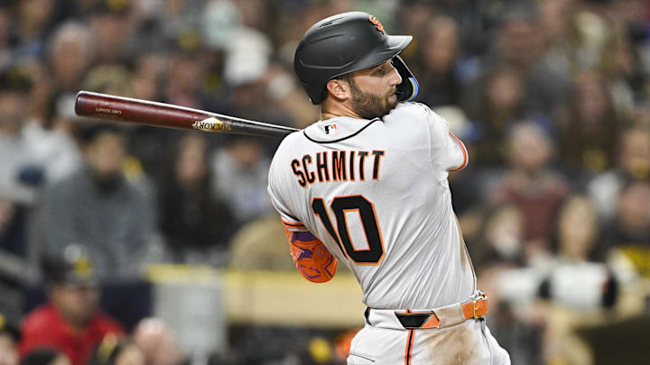 Mar 30, 2026; San Diego, California, USA; San Francisco Giants first baseman Casey Schmitt (10) hits an RBI single during the fourth inning against the San Diego Padres at Petco Park. Mandatory Credit: Denis Poroy-Imagn Images
