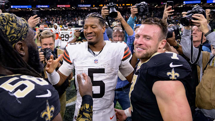 Nov 17, 2024; New Orleans, Louisiana, USA; Cleveland Browns quarterback Jameis Winston (5) hugs his former teammates including New Orleans Saints linebacker Demario Davis (56) and New Orleans Saints tight end Taysom Hill (7) at the end of the game at Caesars Superdome. Mandatory Credit: Matthew Hinton-Imagn Images