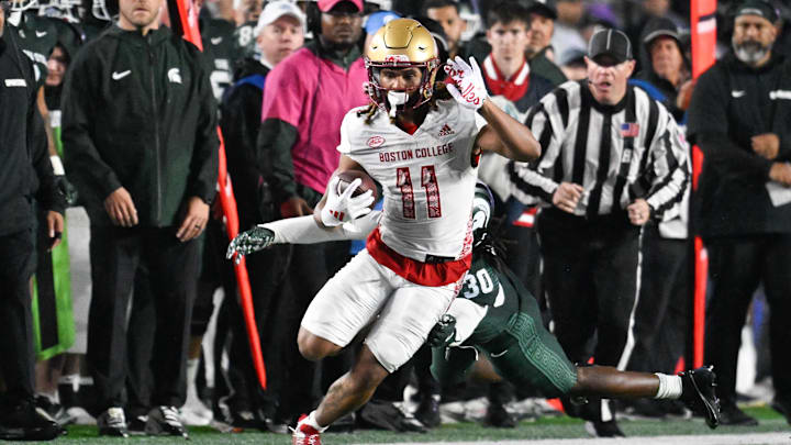 Sep 21, 2024; Chestnut Hill, Massachusetts, USA; Boston College Eagles wide receiver Lewis Bond (11) runs the ball against the Michigan State Spartans during the second half at Alumni Stadium. Mandatory Credit: Eric Canha-Imagn Images