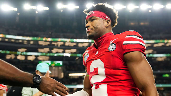 Ohio State Buckeyes defensive back Caleb Downs (2) leaves the field following the Cotton Bowl at AT&T Stadium in Arlington, Texas for the College Football Playoff quarterfinal game against the Miami Hurricanes on Dec. 31, 2025. Ohio State lost 24-14.
