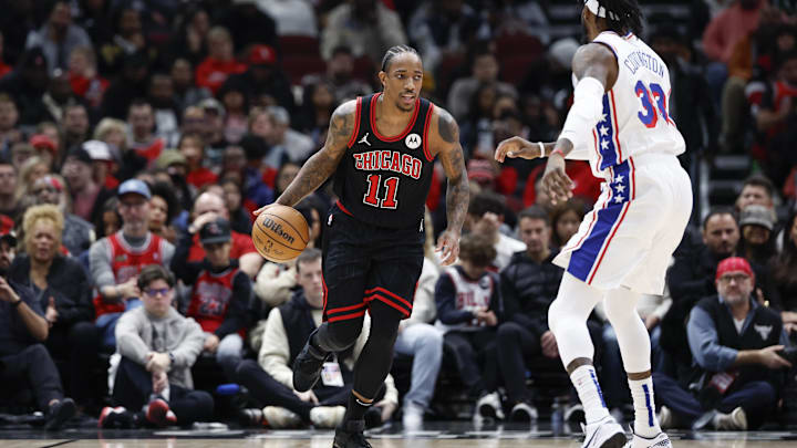 Dec 30, 2023; Chicago, Illinois, USA; Chicago Bulls forward DeMar DeRozan (11) brings the ball up court against the Philadelphia 76ers during the first half at United Center. Mandatory Credit: Kamil Krzaczynski-Imagn Images
