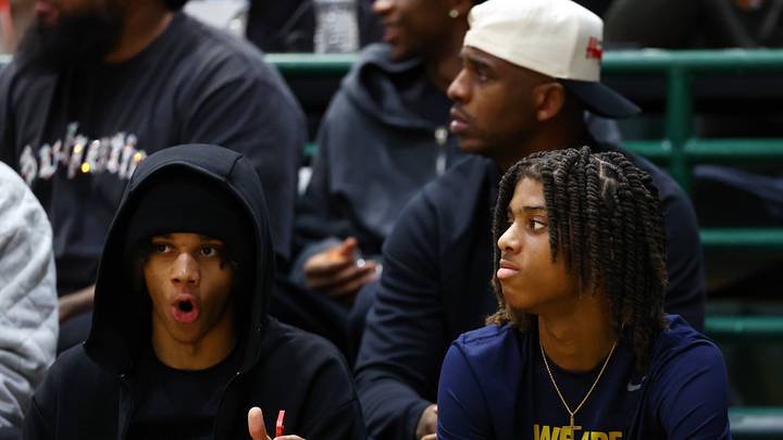 Jan 2, 2026; Mesa, AZ, USA; Chris Paul II (near) in front of father Chris Paul during the HoopHall West Tournament at Skyline High School. Mandatory Credit: Mark J. Rebilas-Imagn Images Jan 2, 2026; Mesa, AZ, USA; Chris Paul II (near) in front of father Chris Paul during the HoopHall West Tournament at Skyline High School. Mandatory Credit: Mark J. Rebilas-Imagn Images