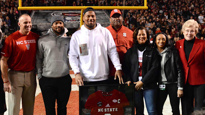 Nov 8, 2018; Raleigh, NC, USA; North Carolina State Wolfpack alumni and current Denver Bronco defensive end Bradley Chubb (center) has his number placed in the ring of honor during the second half at Carter-Finley Stadium. The Demon Deacons defeated North Carolina State 27-23.  Mandatory Credit: Rob Kinnan-Imagn Images