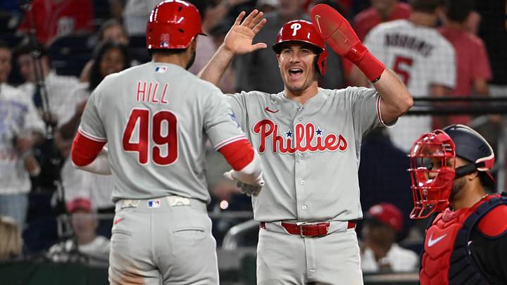 Jun 25, 2026; Washington, District of Columbia, USA; Philadelphia Phillies right fielder Derek Hill (49) is congratulated by catcher J.T. Realmuto (10) after hitting a two run home run against the Washington Nationals during the ninth inning at Nationals Park.