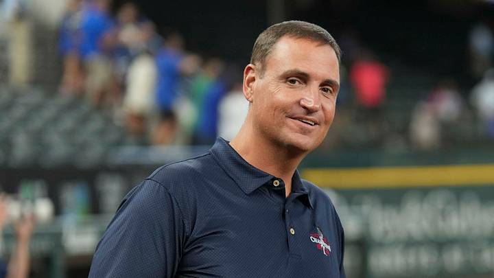 Jun 21, 2024; Arlington, Texas, USA; Texas Rangers general manager Chris Young (left) and Kansas City Royals general manager J.J. Picollo (right) talk before the game against the Kansas City Royals at Globe Life Field. Mandatory Credit: Jim Cowsert-USA TODAY Sports