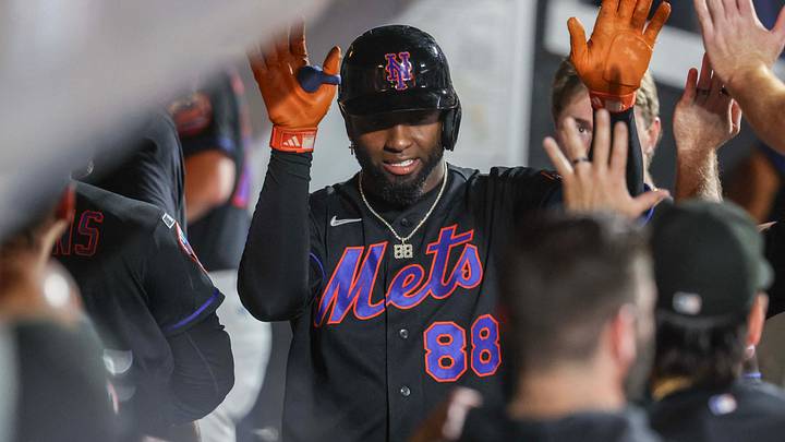 Aug 25, 2026; New York City, New York, USA;  New York Mets center fielder Luis Robert Jr. (88) celebrates in the dugout with his teammates after hitting a solo home run in the sixth inning against the Milwaukee Brewers at Citi Field.  Mandatory Credit: Wendell Cruz-Imagn Images