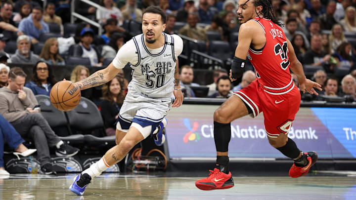 Orlando Magic guard Cole Anthony (50) drives to the basket past Chicago Bulls guard Tre Jones (30) in the first quarter at Kia Center.