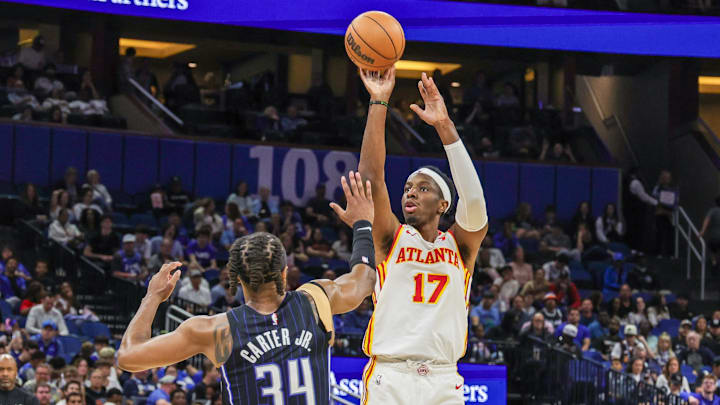 Apr 8, 2025; Orlando, Florida, USA; Atlanta Hawks forward Onyeka Okongwu (17) shoots a three point basket against Orlando Magic center Wendell Carter Jr. (34) during the second quarter at Kia Center. Mandatory Credit: Mike Watters-Imagn Images Apr 8, 2025; Orlando, Florida, USA; Atlanta Hawks forward Onyeka Okongwu (17) shoots a three point basket against Orlando Magic center Wendell Carter Jr. (34) during the second quarter at Kia Center. Mandatory Credit: Mike Watters-Imagn Images