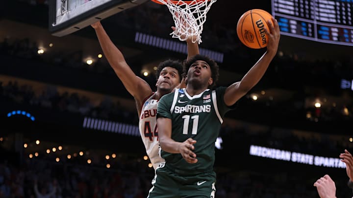 Mar 30, 2025; Atlanta, GA, USA; Michigan State Spartans guard Jase Richardson (11) shoots against Auburn Tigers center Dylan Cardwell (44) during the second half in the South Regional final of the 2025 NCAA tournament at State Farm Arena. Mandatory Credit: Brett Davis-Imagn Images