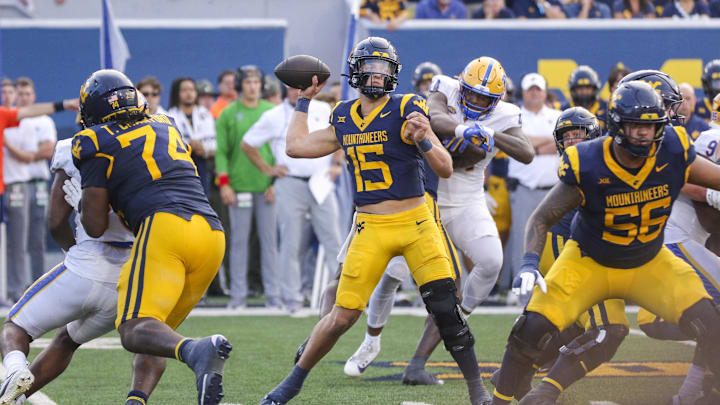 Sep 13, 2025; Morgantown, West Virginia, USA; West Virginia Mountaineers quarterback Scotty Fox Jr. (15) throws a pass during the third quarter against the Pittsburgh Panthers at Milan Puskar Stadium. Mandatory Credit: Ben Queen-Imagn Images Sep 13, 2025; Morgantown, West Virginia, USA; West Virginia Mountaineers quarterback Scotty Fox Jr. (15) throws a pass during the third quarter against the Pittsburgh Panthers at Milan Puskar Stadium. Mandatory Credit: Ben Queen-Imagn Images