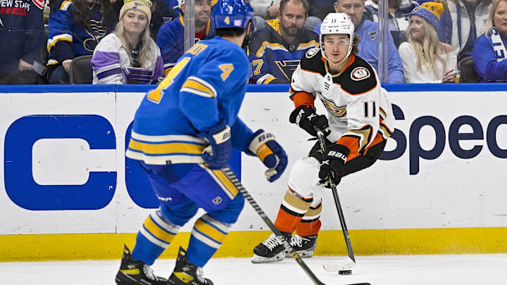 Nov 19, 2022; St. Louis, Missouri, USA;  Anaheim Ducks center Trevor Zegras (11) controls the puck against the St. Louis Blues during the third period at Enterprise Center. Mandatory Credit: Jeff Curry-Imagn Images