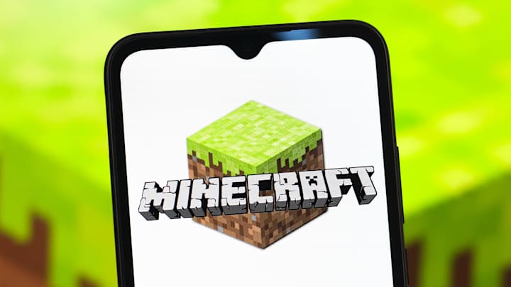 In this photo illustration, the Minecraft logo is seen...
