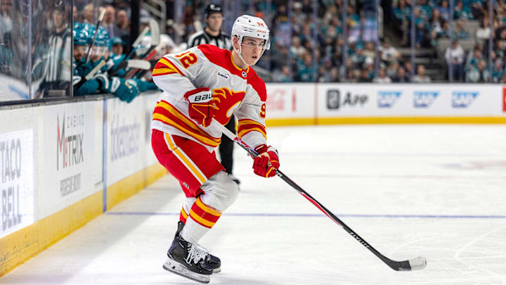 Feb 26, 2026; San Jose, California, USA; Calgary Flames right wing Matvei Gridin (92) looks for a shot during the first period against the San Jose Sharks at SAP Center at San Jose. Mandatory Credit: Bob Kupbens-Imagn Images