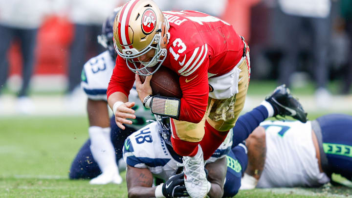 Seattle Seahawks linebacker Tyrice Knight (48) tackles San Francisco 49ers quarterback Brock Purdy (13)