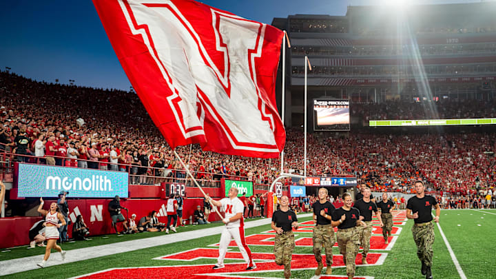 Sep 20, 2024; Lincoln, Nebraska, USA; A Nebraska Cornhuskers flag is waved after a touchdown against the Illinois Fighting Illini during the first quarter at Memorial Stadium. 