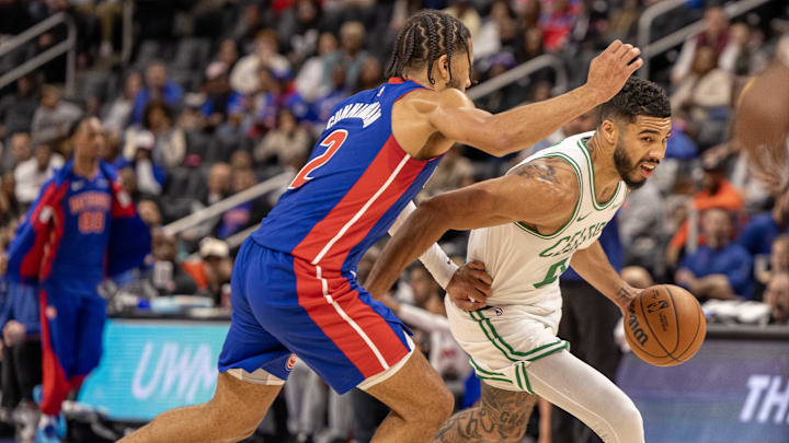 Oct 26, 2024; Detroit, Michigan, USA; Boston Celtics forward Jayson Tatum (0) drives to the basket against Detroit Pistons guard Cade Cunningham (2): David Reginek-Imagn Images