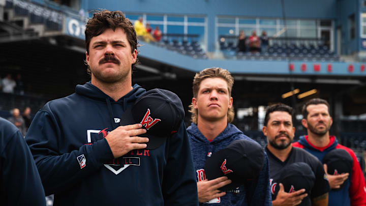 Pitchers Payton Tolle (left) and Connelly Early (second from left) stand for the national anthem ahead of Triple-A Worcester's game at Polar Park on Aug. 21, 2025.
