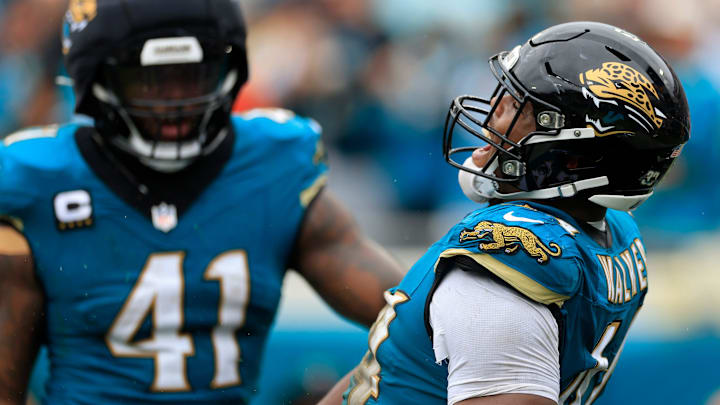 Jacksonville Jaguars defensive end Travon Walker (44) reacts to forcing a fumble with defensive end Josh Hines-Allen (41) during the second quarter of an NFL football matchup Sunday, Oct. 6, 2024 at EverBank Stadium in Jacksonville, Fla. Jacksonville Jaguars defensive end Travon Walker (44) reacts to forcing a fumble with defensive end Josh Hines-Allen (41) during the second quarter of an NFL football matchup Sunday, Oct. 6, 2024 at EverBank Stadium in Jacksonville, Fla.