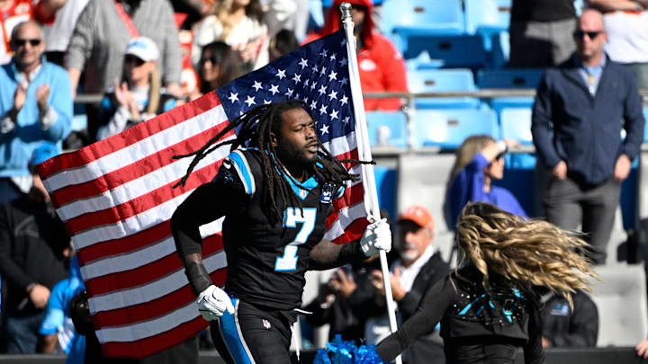 Nov 24, 2024; Charlotte, North Carolina, USA;  Carolina Panthers linebacker Jadeveon Clowney (7) runs on to the field before the game at Bank of America Stadium. Mandatory Credit: Bob Donnan-Imagn Images
