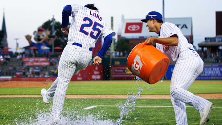 South Bend Cubs outfielder Brett Bateman, right, throws water on infielder Jonathon Long after winning a minor league baseball 4-3 against the Lake County Captains game at Four Winds Field on Friday, June 21, 2024, in South Bend.