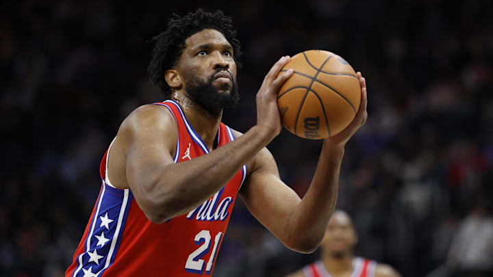 Feb 7, 2025; Detroit, Michigan, USA;  Philadelphia 76ers center Joel Embiid (21) shoots in the first half against the Detroit Red Wings at Little Caesars Arena. Mandatory Credit: Rick Osentoski-Imagn Images