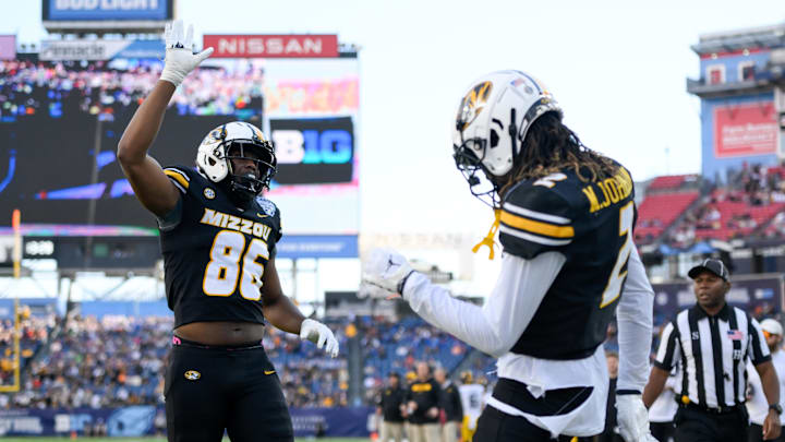 Dec 30, 2024; Nashville, TN, USA;  Missouri Tigers wide receiver Marquis Johnson (2) celebrates with tight end Jordon Harris (86) after his touchdown against the Iowa Hawkeyes during the first half at Nissan Stadium. Mandatory Credit: Steve Roberts-Imagn Images
