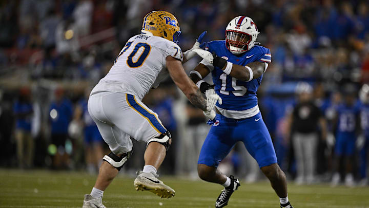 Nov 2, 2024; Dallas, Texas, USA; Pittsburgh Panthers offensive lineman Ryan Baer (70) and Southern Methodist Mustangs defensive end Cameron Robertson (15) in action during the game between the Southern Methodist Mustangs and the Pittsburgh Panthers at Gerald J. Ford Stadium. Mandatory Credit: Jerome Miron-Imagn Images