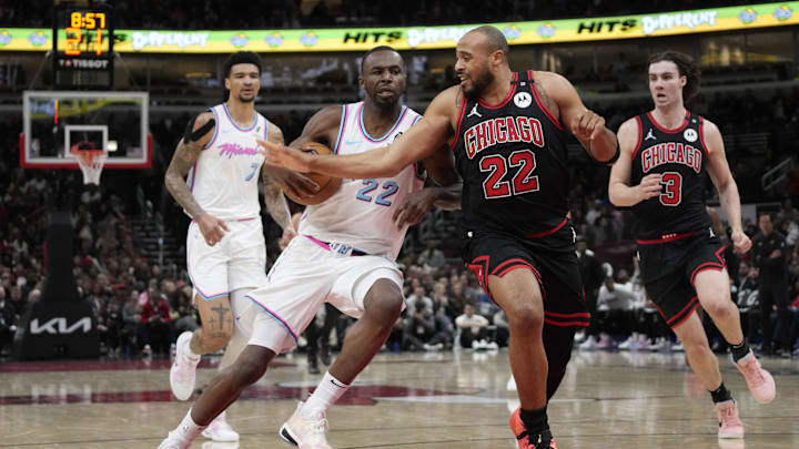 Apr 9, 2025; Chicago, Illinois, USA; Chicago Bulls forward Talen Horton-Tucker (22) defends Miami Heat forward Andrew Wiggins (22) during the second half at United Center. Mandatory Credit: David Banks-Imagn Images