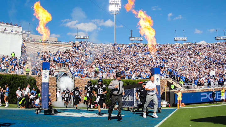 Sep 28, 2024; Durham, North Carolina, USA;  Duke Blue Devils head coach Manny Diaz runs out before the first half of the game against the North Carolina Tar Heels at Wallace Wade Stadium.