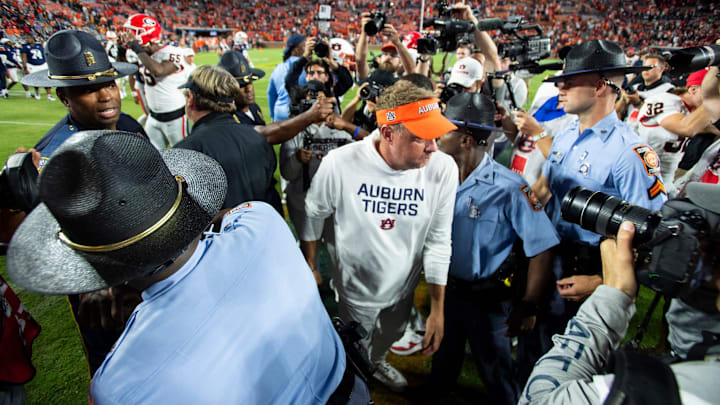 Georgia Bulldogs head coach Kirby Smart and Auburn Tigers head coach Hugh Freeze shake hands after the game as Auburn Tigers take on Georgia Bulldogs at Jordan-Hare Stadium in Auburn, Ala. on Saturday, Oct. 11, 2025. Georgia Bulldogs defeated Auburn Tigers 20-10.