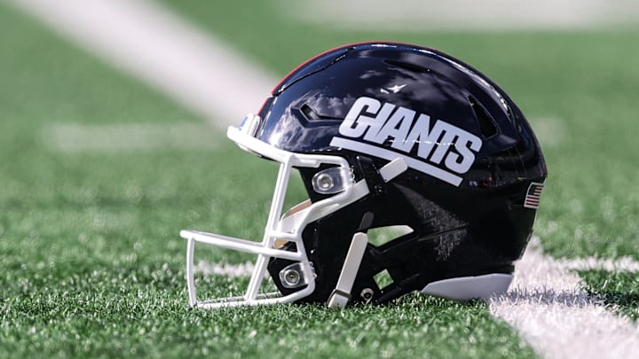 Nov 16, 2025; East Rutherford, New Jersey, USA; A New York Giants helmet rests on the field before the game between the Giants and the Green Bay Packers at MetLife Stadium. Mandatory Credit: Vincent Carchietta-Imagn Images