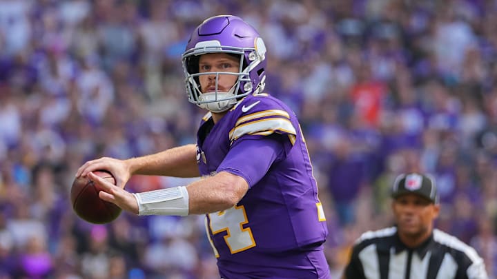 Minnesota Vikings quarterback Sam Darnold (14) throws a pass for a touchdown against the Houston Texans in the first quarter at U.S. Bank Stadium in Minneapolis on Sept. 22, 2024.