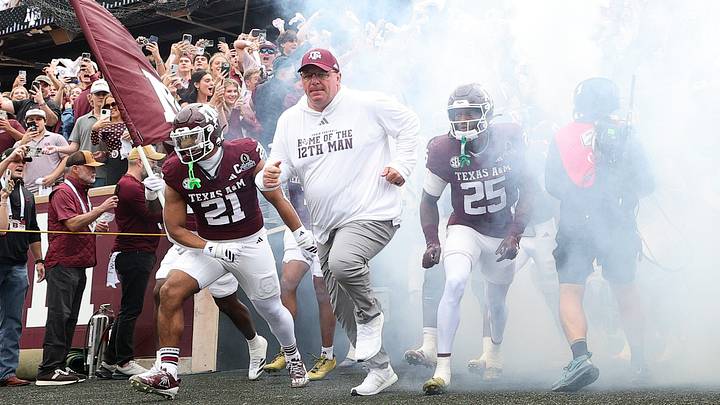 Dec 20, 2025; College Station, TX, USA; Texas A&M Aggies head coach Mike Elko takes the field prior to the game against the Miami Hurricanes during the first round of the CFP National Playoff at Kyle Field. Mandatory Credit: Maria Lysaker-Imagn Images Dec 20, 2025; College Station, TX, USA; Texas A&M Aggies head coach Mike Elko takes the field prior to the game against the Miami Hurricanes during the first round of the CFP National Playoff at Kyle Field. Mandatory Credit: Maria Lysaker-Imagn Images