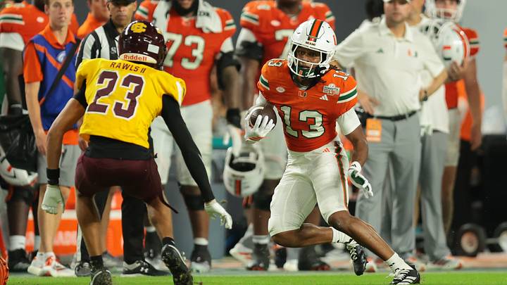 Sep 6, 2025; Miami Gardens, Florida, USA; Miami Hurricanes wide receiver Daylyn Upshaw (13) runs with the football against Bethune-Cookman Wildcats safety Nichalas Rawls II (23) during the fourth quarter at Hard Rock Stadium. Mandatory Credit: Sam Navarro-Imagn Images Sep 6, 2025; Miami Gardens, Florida, USA; Miami Hurricanes wide receiver Daylyn Upshaw (13) runs with the football against Bethune-Cookman Wildcats safety Nichalas Rawls II (23) during the fourth quarter at Hard Rock Stadium. Mandatory Credit: Sam Navarro-Imagn Images