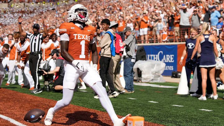 Texas Longhorns punt returner Xavier Worthy scores a touchdown on a punt return against the BYU Cougars.