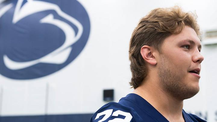 Penn State offensive lineman Nolan Rucci talks with TV reporters during football media day in Holuba Hall on Saturday, August 3, 2024, in State College.
