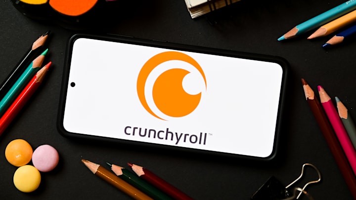 In this photo illustration a Crunchyroll logo seen displayed...