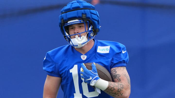May 28, 2025; Woodland Hills, CA, USA; Los Angeles Rams tight end Terrance Ferguson (18) runs with the ball during organized team activities at Rams Practice Facility. 