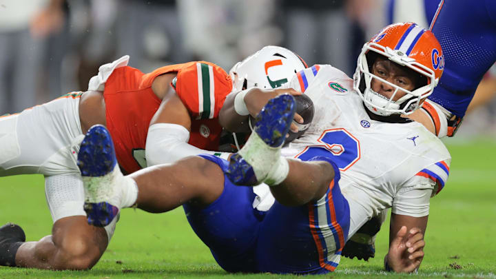 Sep 20, 2025; Miami Gardens, Florida, USA; Florida Gators quarterback DJ Lagway (2) is sacked by Florida Gators linebacker Aaron Chiles (8) during the second quarter at Hard Rock Stadium. Mandatory Credit: Sam Navarro-Imagn Images