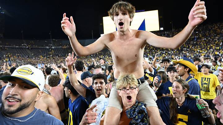 Sep 5, 2026; Ann Arbor, Michigan, USA;  Michigan fans storm the field after Michigan beat Western Michigan on a Hail Mary touchdown pass with time expired at Michigan Stadium.  Mandatory Credit: Lon Horwedel-Imagn Images