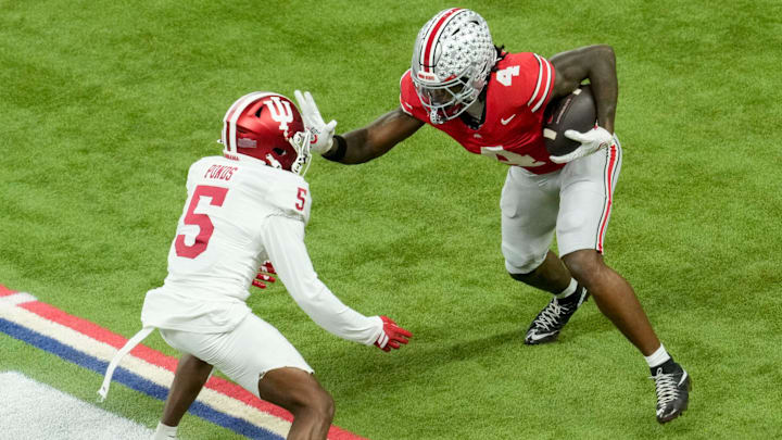 Ohio State Buckeyes wide receiver Jeremiah Smith (4) looks to move past Indiana Hoosiers defensive back D'Angelo Ponds (5) on Saturday, Dec. 6, 2025, during the Big Ten football championship at Lucas Oil Stadium in Indianapolis.