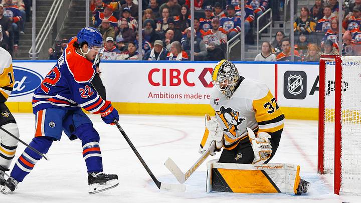 Jan 22, 2026; Edmonton, Alberta, CAN; Pittsburgh Penguins goaltender Arturs Silovs (37) makes a save on  on Edmonton Oilers forward Matt Savoie (22) during the third period at Rogers Place. Mandatory Credit: Perry Nelson-Imagn Images