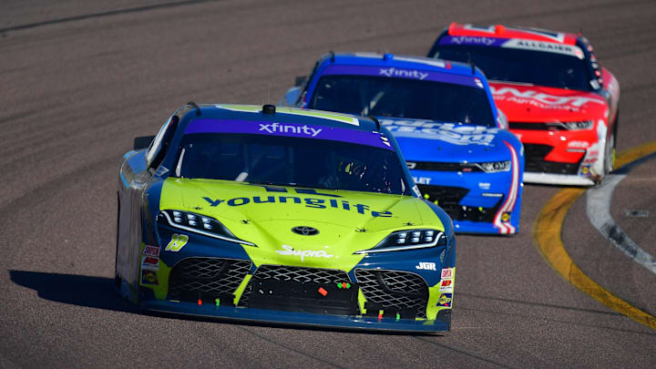 Mar 8, 2025; Avondale, Arizona, USA; NASCAR Xfinity Series driver Aric Almirola (19) leads driver Alex Bowman (17) and driver Justin Allgaier (7) during the GovX 200 at Phoenix Raceway.