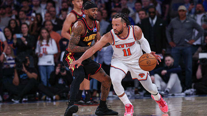 Apr 18, 2026; New York, New York, USA; New York Knicks guard Jalen Brunson (11) dribbles as Atlanta Hawks guard Nickeil Alexander-Walker (7) defends during the second half of the 2026 NBA Playoffs at Madison Square Garden. Mandatory Credit: Vincent Carchietta-Imagn Images