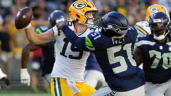 Seattle Seahawks linebacker Jared Ivey (51) tackles Green Bay Packers quarterback Taylor Elgersma (19). Seattle Seahawks linebacker Jared Ivey (51) tackles Green Bay Packers quarterback Taylor Elgersma (19).